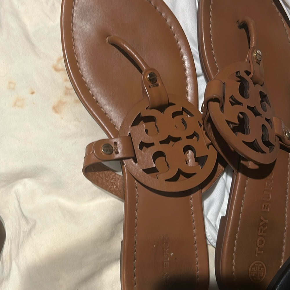 I’m selling either 1 or two of my Torrey Burch sandals my dogs chewed all my